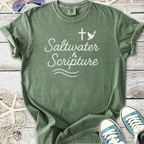 Green cotton t-shirt featuring 'Saltwater & Scripture' design with cross and bird motif.