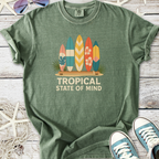 Green graphic t-shirt featuring colorful surfboards and 'Tropical State of Mind' printed design.