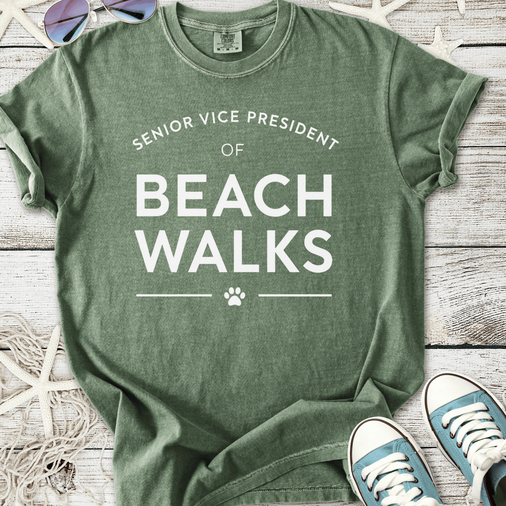 Green cotton t-shirt featuring 'Senior Vice President of Beach Walks' text with paw print design.