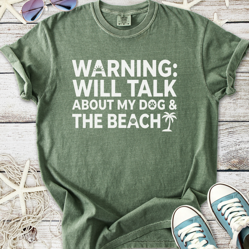 Green graphic tee featuring 'Warning: Will Talk About My Dog & The Beach' text, perfect for dog lovers.