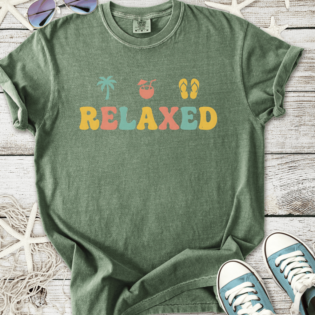 Green relaxed graphic t-shirt with palm tree, drink, and flip-flop designs, perfect for casual summer wear.