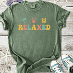 Green relaxed graphic t-shirt with palm tree, drink, and flip-flop designs, perfect for casual summer wear.