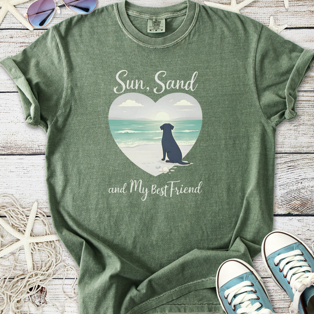 Green graphic t-shirt with 'Sun, Sand and My Best Friend' design and beach-themed illustration.