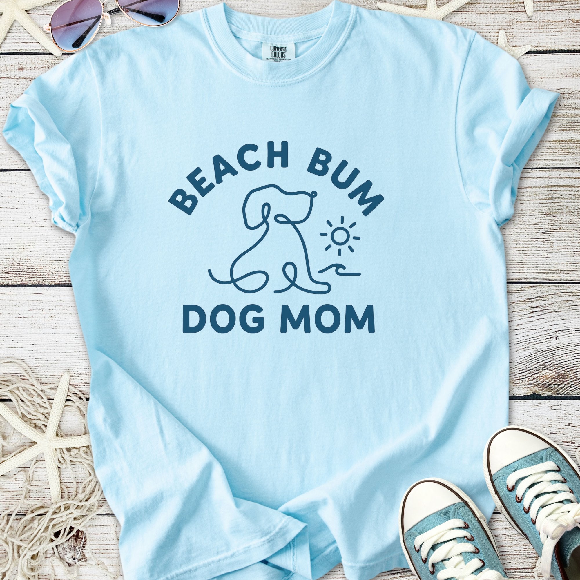 Light blue t-shirt for dog moms with 'Beach Bum' graphic, casual style, perfect for summer outings.
