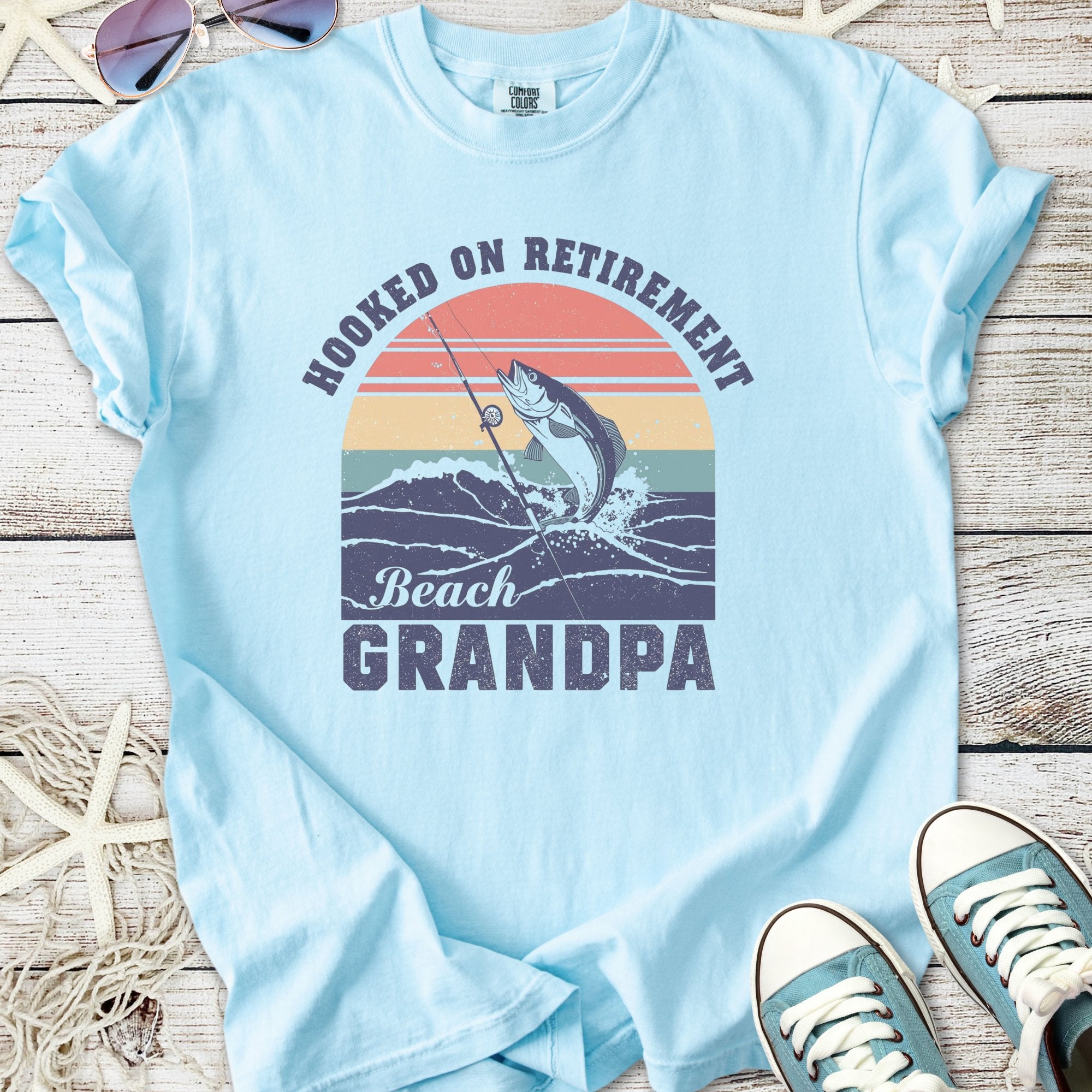 Light blue t-shirt with 'Hooked on Retirement Beach Grandpa' graphic and fishing design.