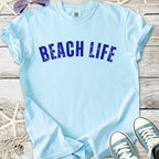Light blue t-shirt with 'BEACH LIFE' graphic, perfect for summer beachwear.