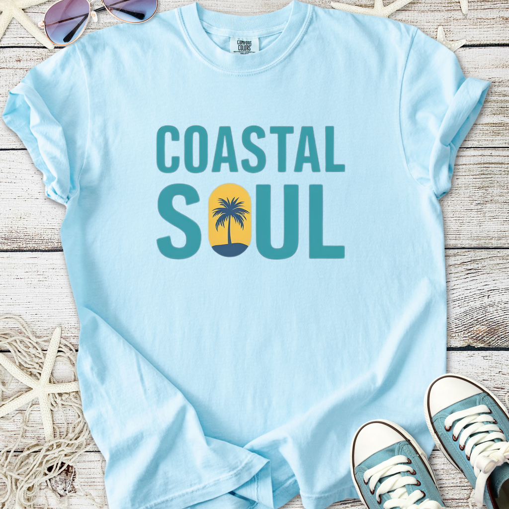 Light blue cotton t-shirt with 'Coastal Soul' print and palm tree design, perfect for beach lovers.