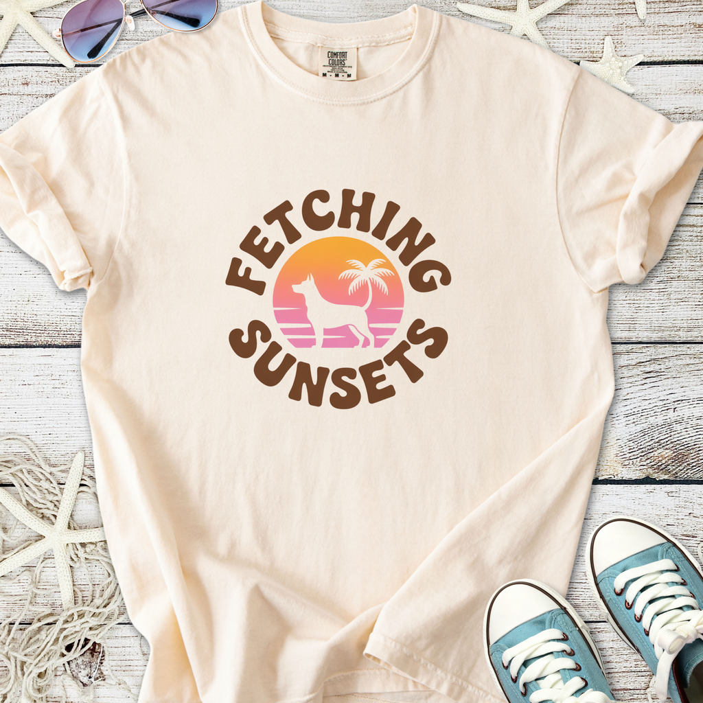 Cream cotton t-shirt with 'Fetching Sunsets' graphic featuring dog and palm tree design.