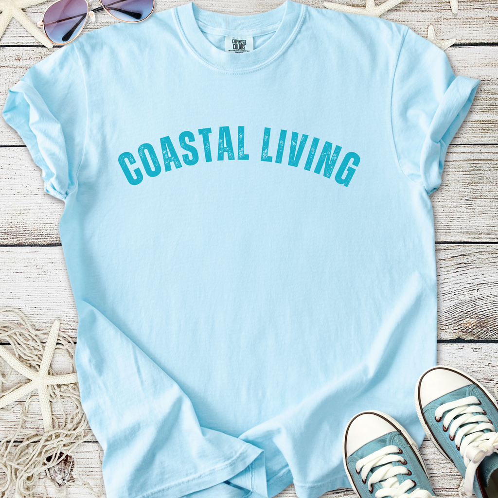 Light blue coastal living t-shirt, casual style, soft cotton material, perfect for summer outings.