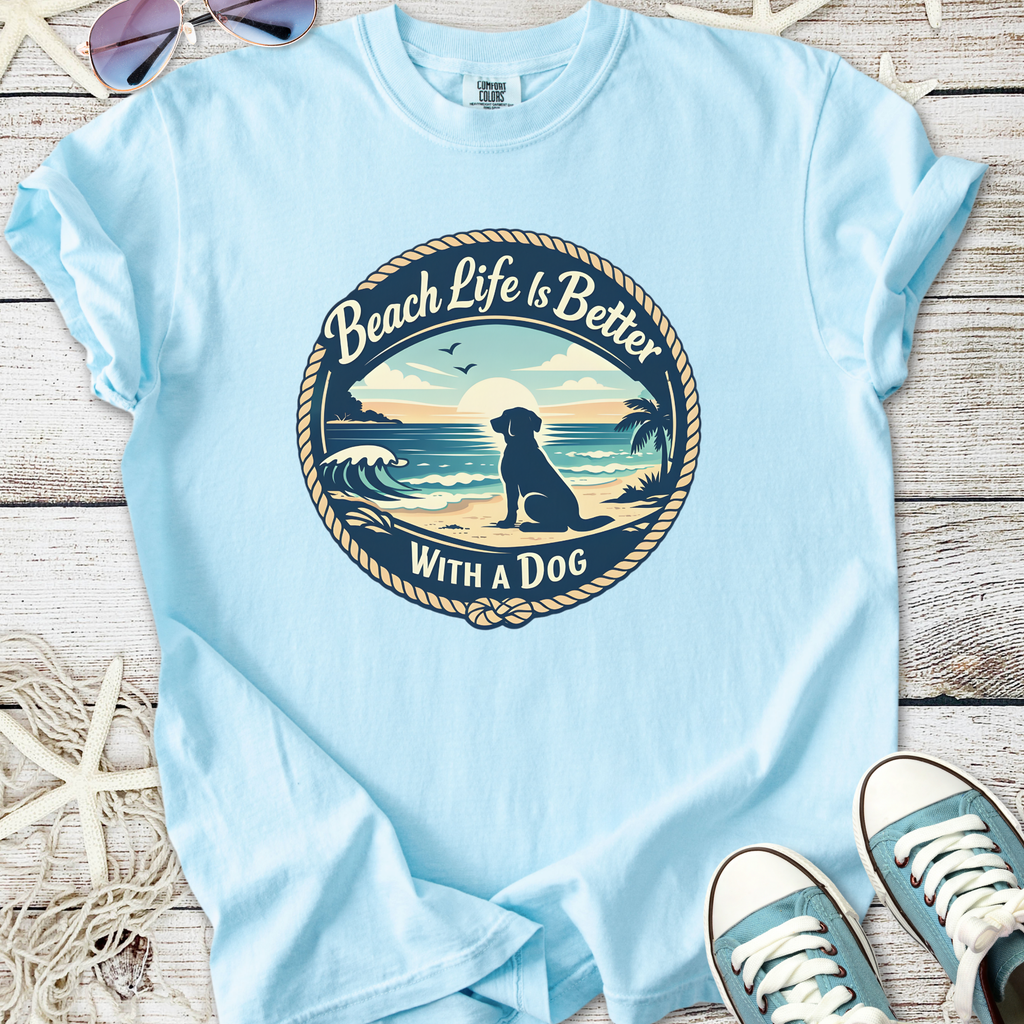 Light blue t-shirt featuring 'Beach Life Is Better With a Dog' graphic, perfect for dog lovers.
