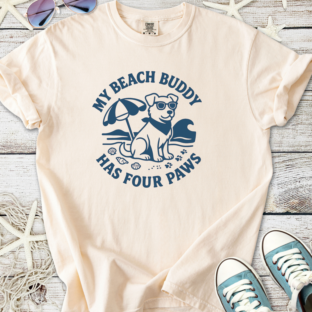 Cream t-shirt featuring a dog graphic with sunglasses and beach accessories, perfect for dog lovers.