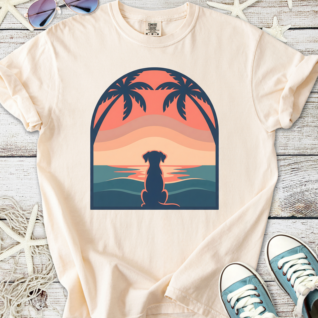 Cream t-shirt featuring a sunset dog silhouette design with palm trees, perfect for casual wear.