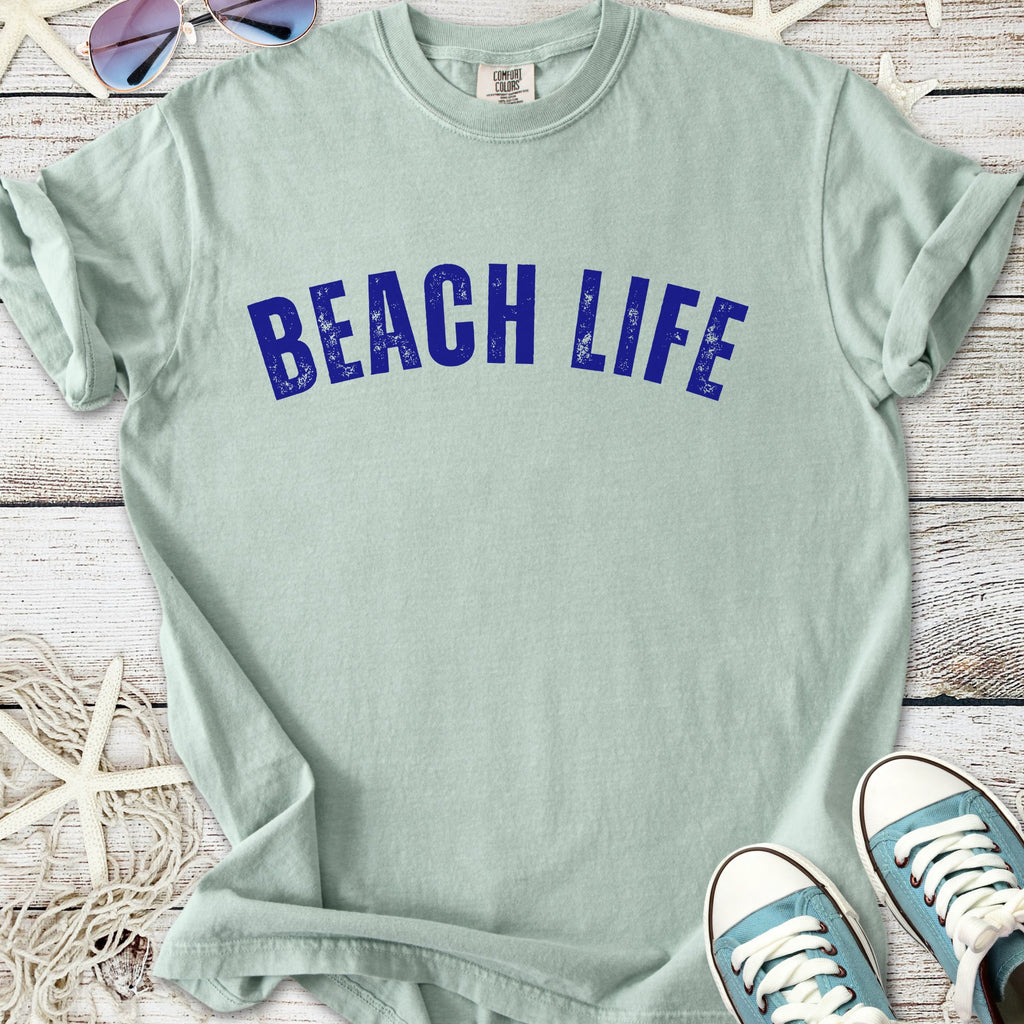 Light green t-shirt with 'BEACH LIFE' printed in bold blue, perfect for summer outfits.
