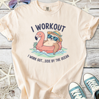 Light peach graphic t-shirt featuring a playful sloth on a flamingo float with beach theme slogan.