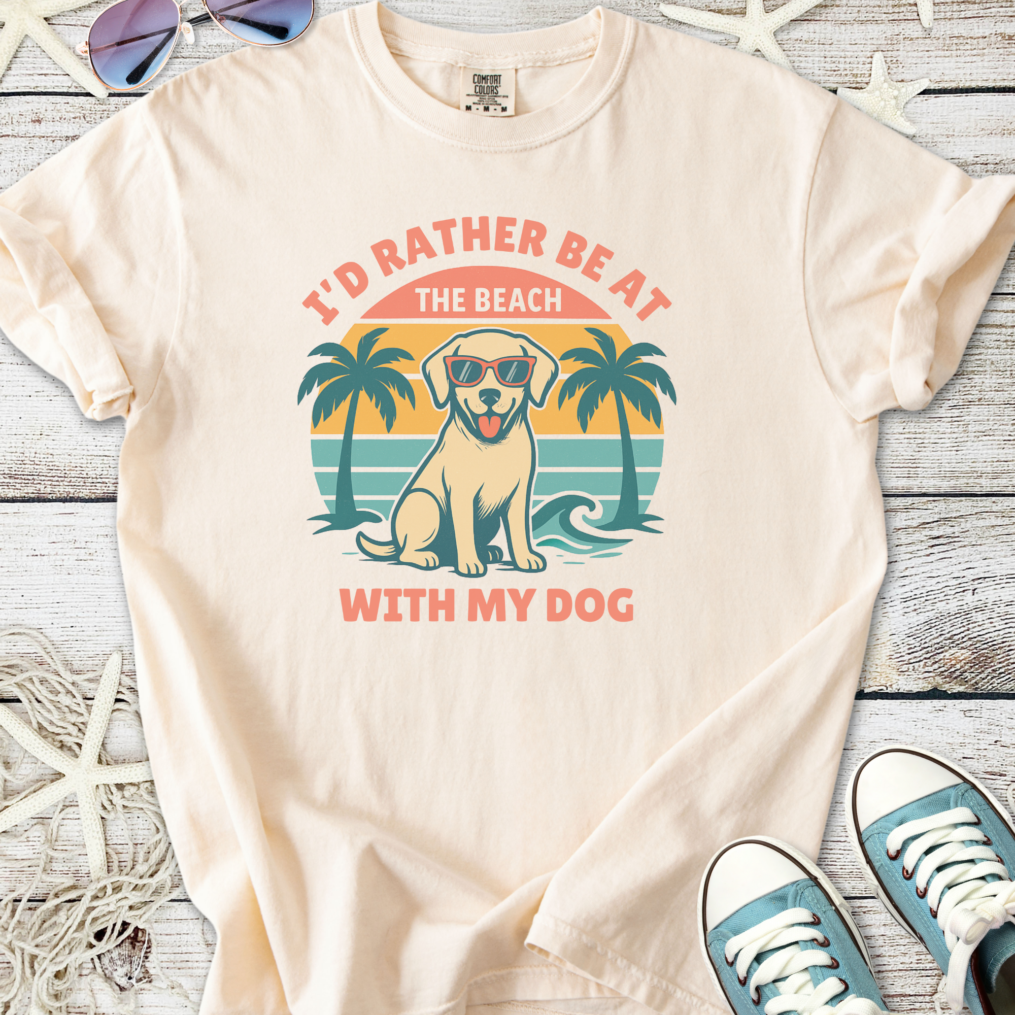 Cream t-shirt with beach dog graphic, saying 'I'd Rather Be At The Beach With My Dog'.