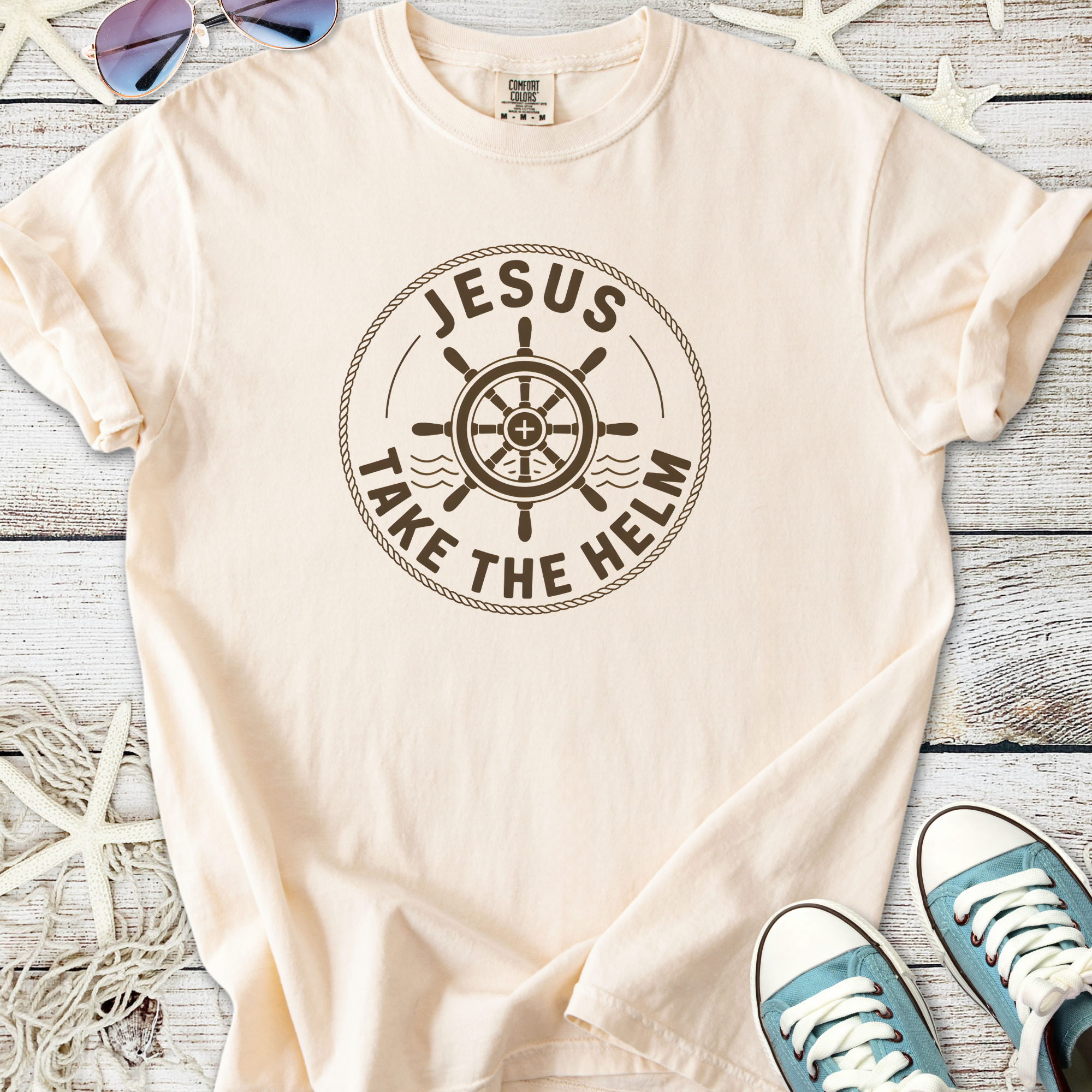 Beige cotton t-shirt with 'Jesus Take the Helm' graphic and ship wheel design, perfect for casual wear.