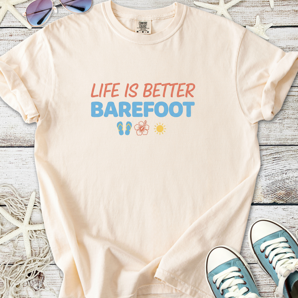 Light peach t-shirt with 'Life is Better Barefoot' print, made of soft cotton, perfect for summer outings.
