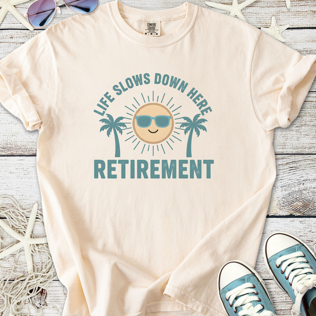 Cream retirement t-shirt with sun and palm tree graphic, perfect for relaxing in style.