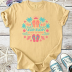 Light beige t-shirt with colorful 'Flip-Flop State of Mind' graphic and tropical design.