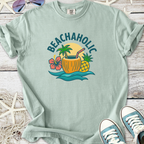 Mint green t-shirt with 'BEACHAHOLIC' graphic, featuring tropical drink and plants design.