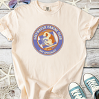 Cream t-shirt featuring Saltwater Canine Club logo, nap specialist, 100% cotton, comfy fit.