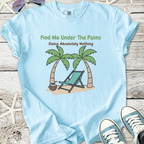 Light blue t-shirt featuring tropical palm trees and lounge chair graphic with the text 'Find Me Under The Palms'.