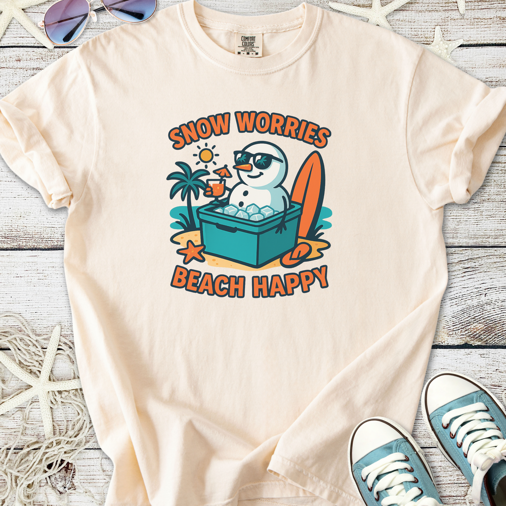 Cream t-shirt featuring a playful snowman graphic with sunglasses, enjoying a beach setting.