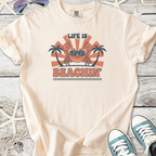 Light beige t-shirt featuring a fun crab graphic with sunglasses, text 'Life is Beachin', perfect for summer wear.