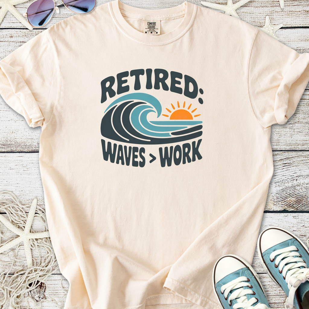 Cream retired t-shirt with waves and sun graphic, made from soft cotton for beach lovers.