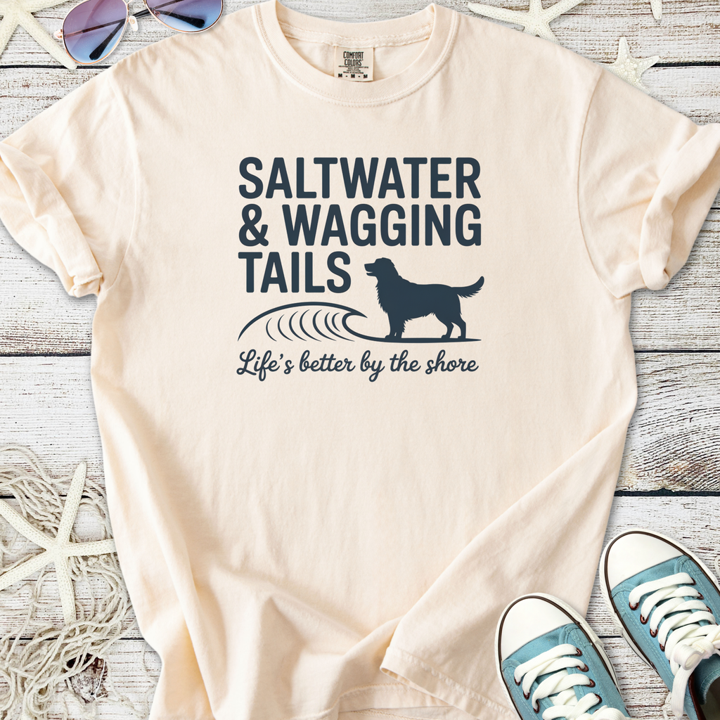 Cream t-shirt with 'Saltwater & Wagging Tails' graphic, perfect for beach lovers and dog owners.