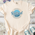 Light peach retired t-shirt with beach graphic, perfect for summer relaxation and casual wear.