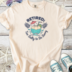 Peach-colored t-shirt with 'Retired: Too Salty to Be Sorry' graphic and coconut drink design.