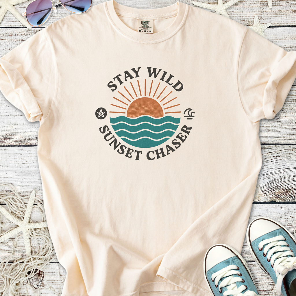 Cream cotton t-shirt with 'Stay Wild Sunset Chaser' graphic and ocean design, perfect for beach lovers.
