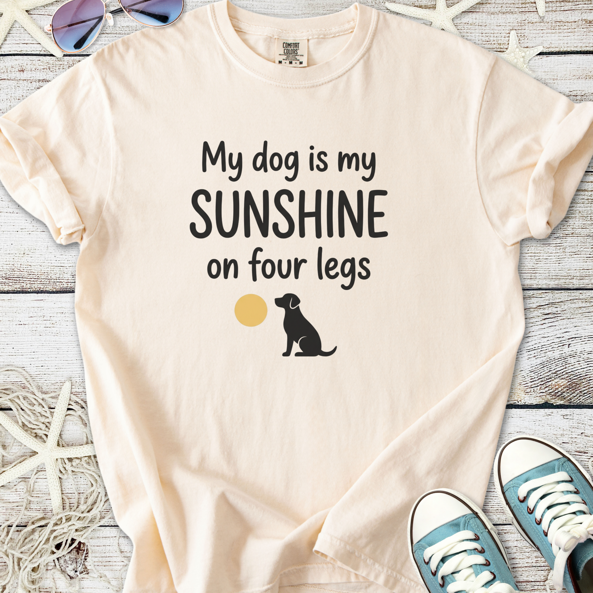 Light peach t-shirt with dog graphic and 'My dog is my sunshine on four legs' text printed.