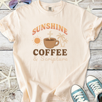 Light beige t-shirt with 'Sunshine Coffee & Scripture' graphic, perfect for casual summer wear.