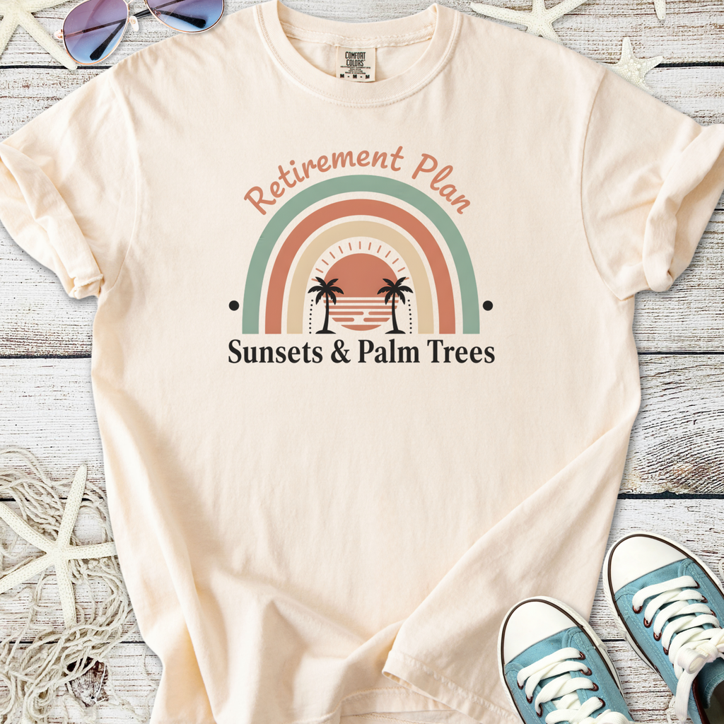 Cream cotton t-shirt with 'Retirement Plan: Sunsets & Palm Trees' graphic design.