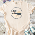 Peach graphic tee with palm trees and sunset design, perfect for beach lovers, made of soft cotton.