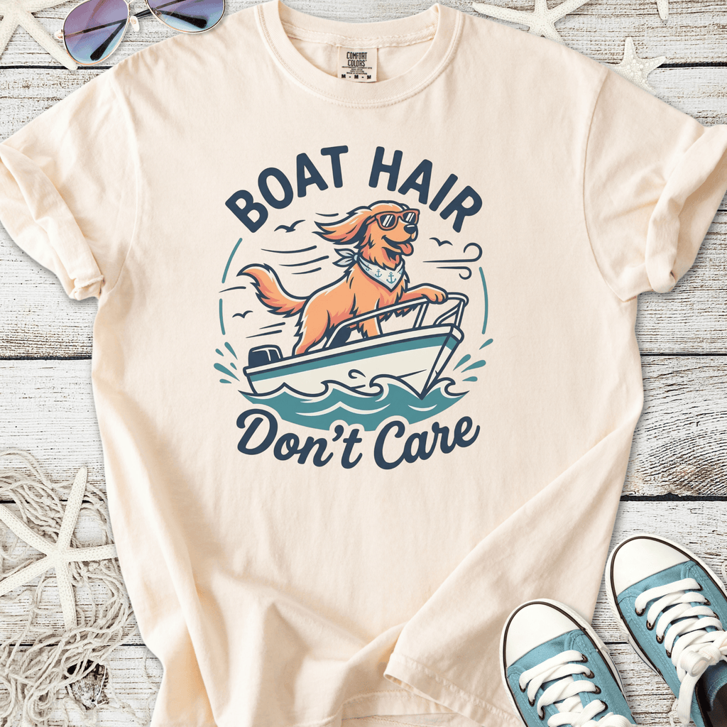 Cream graphic tee featuring a dog on a boat with ‘Boat Hair Don’t Care’ slogan, perfect for casual summer vibes.