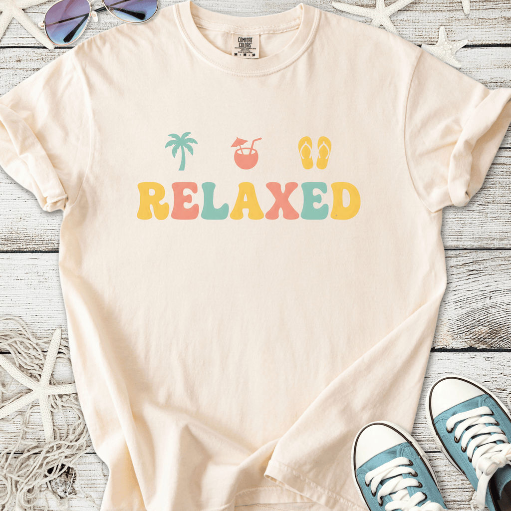 Beige cotton t-shirt with colorful 'RELAXED' graphic, perfect for casual summer wear.