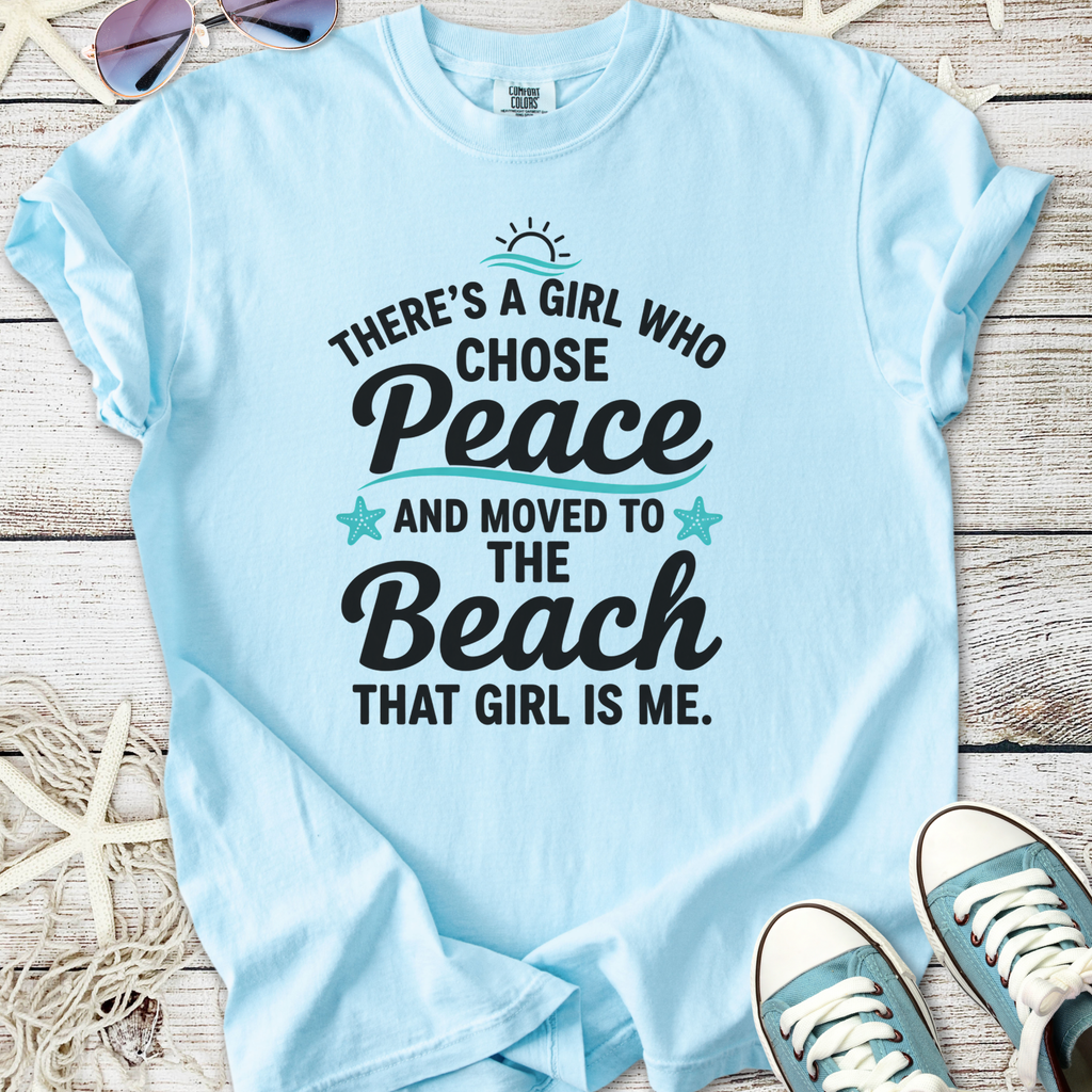 Light blue t-shirt with 'There's a girl who chose Peace and moved to the Beach' text design.