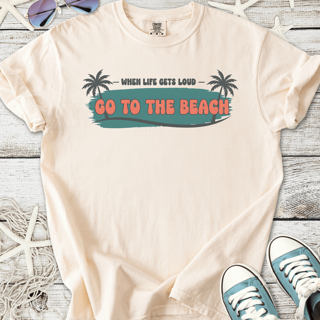 Beige graphic t-shirt with 'Go to the Beach' print and palm tree design, perfect for summer outings.