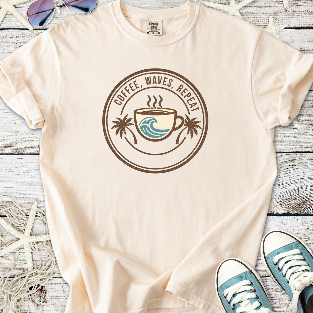 Beige unisex t-shirt with 'Coffee, Waves, Repeat' graphic, featuring a coffee cup and palm trees.