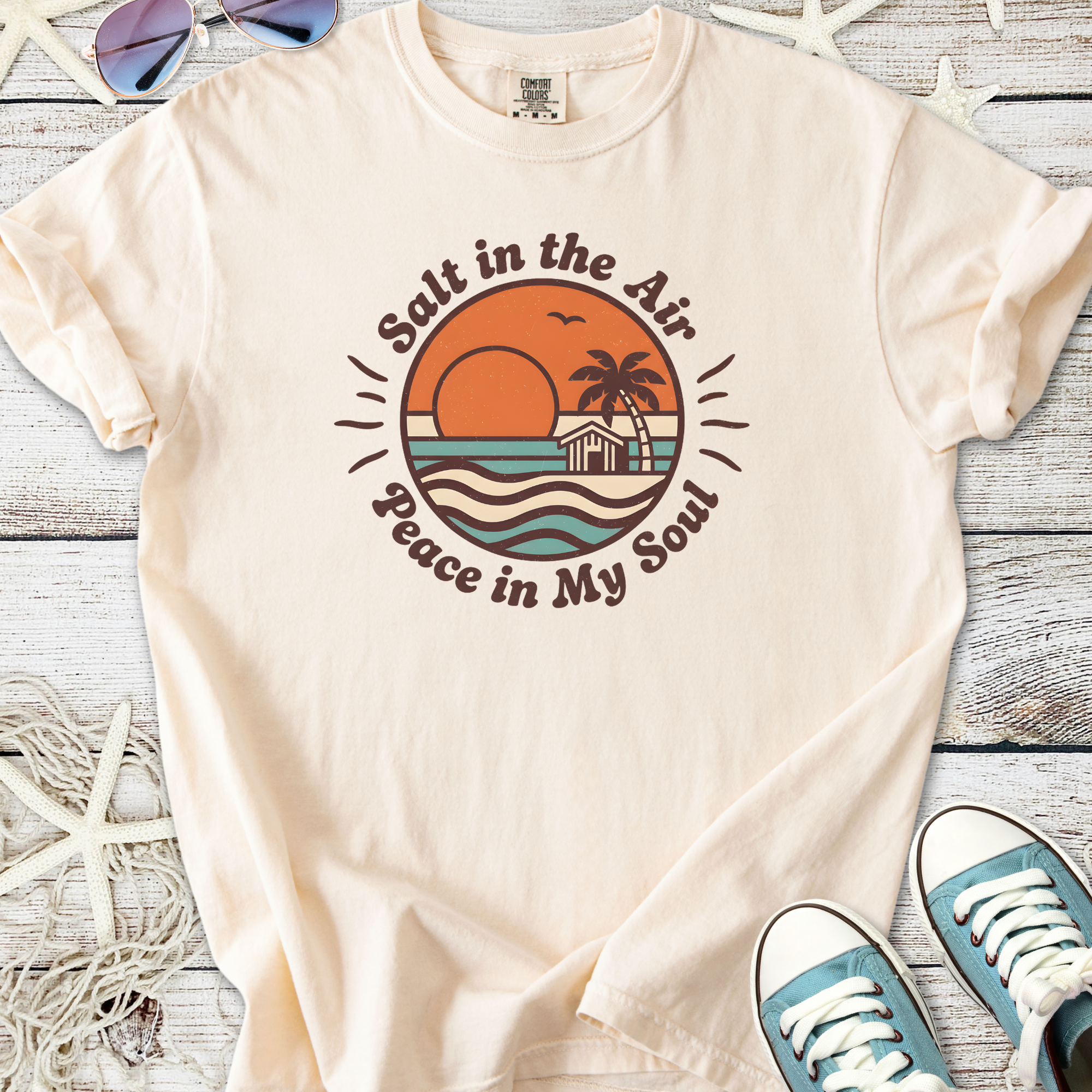Beige cotton t-shirt with 'Salt in the Air, Peace in My Soul' graphic and beach sunset design.