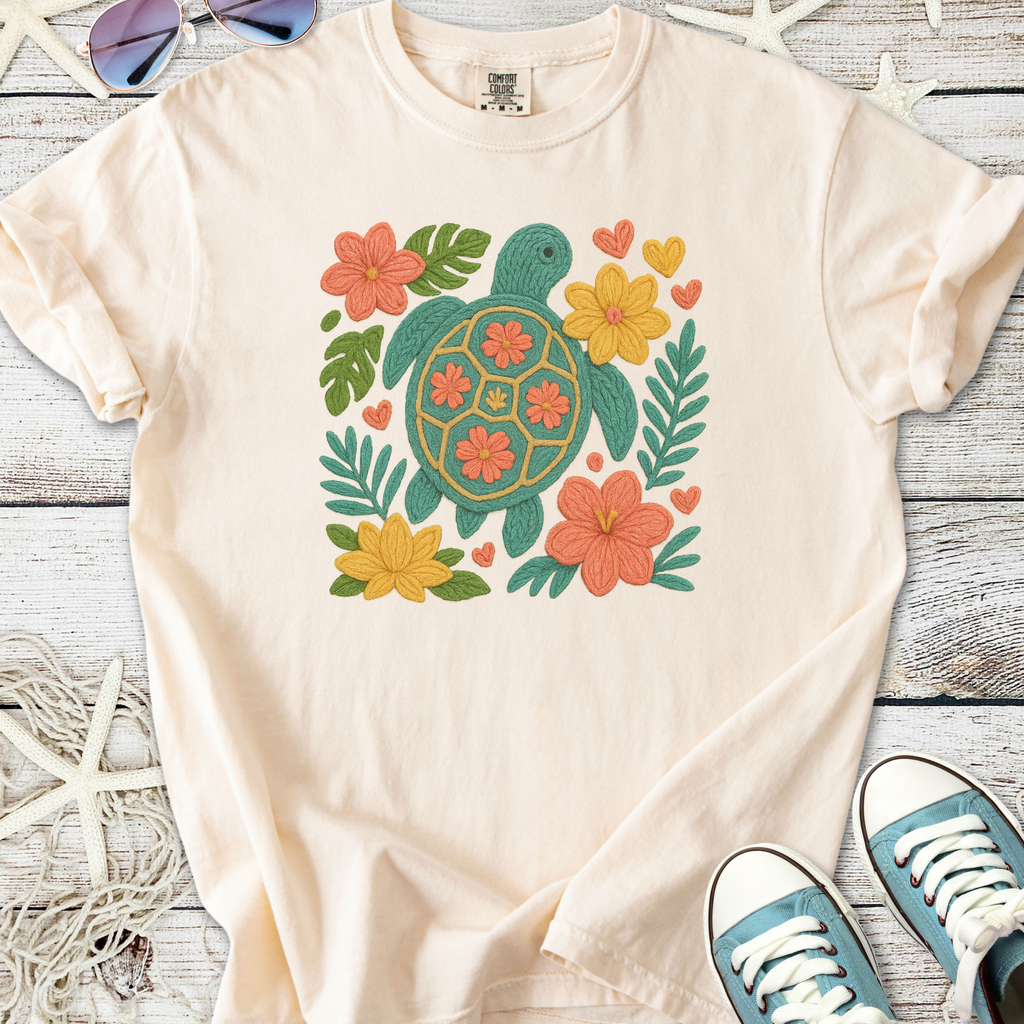 Cream cotton t-shirt with an embroidered turtle and floral design, perfect for casual summer wear.