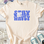 Cream colored t-shirt with 'Stay Wavy' graphic design in blue, perfect for casual summer wear.