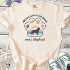 Light beige t-shirt with 'All you need is the beach and a Shepherd' graphic design. Made from soft cotton.
