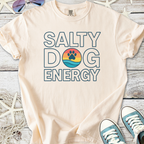 Cream t-shirt with 'Salty Dog Energy' graphic, featuring a beach scene and paw print design.