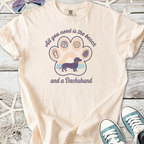 Beige graphic tee featuring a Dachshund and beach elements, perfect for dog lovers and summer vibes.