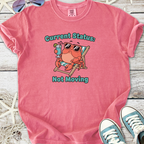 Funny pink t-shirt with crab graphic and 'Current Status: Not Moving' text, perfect for casual wear.