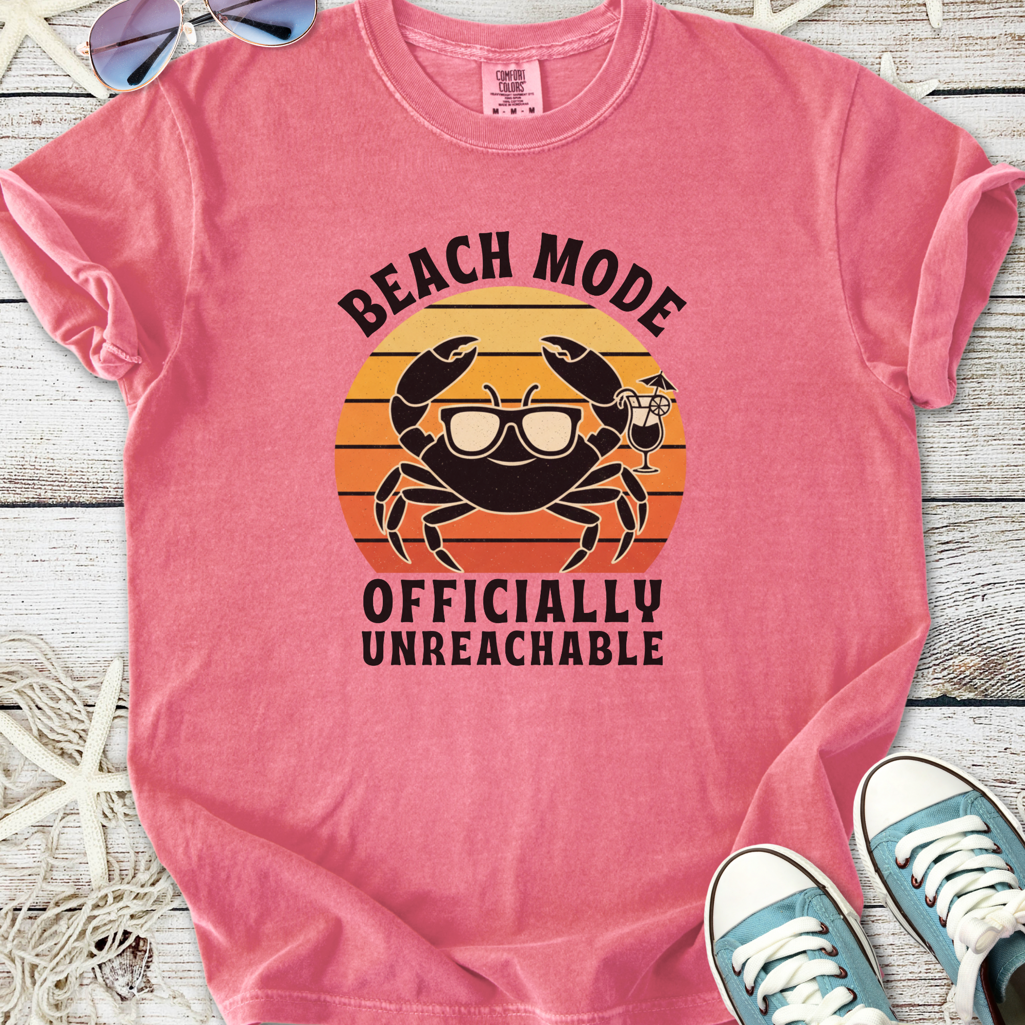 Pink t-shirt with 'Beach Mode Officially Unreachable' and crab design, perfect for summer outings.